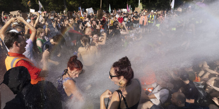 Dutch Police Clear Thousands of Climate Crazies from Highway with Water Cannons